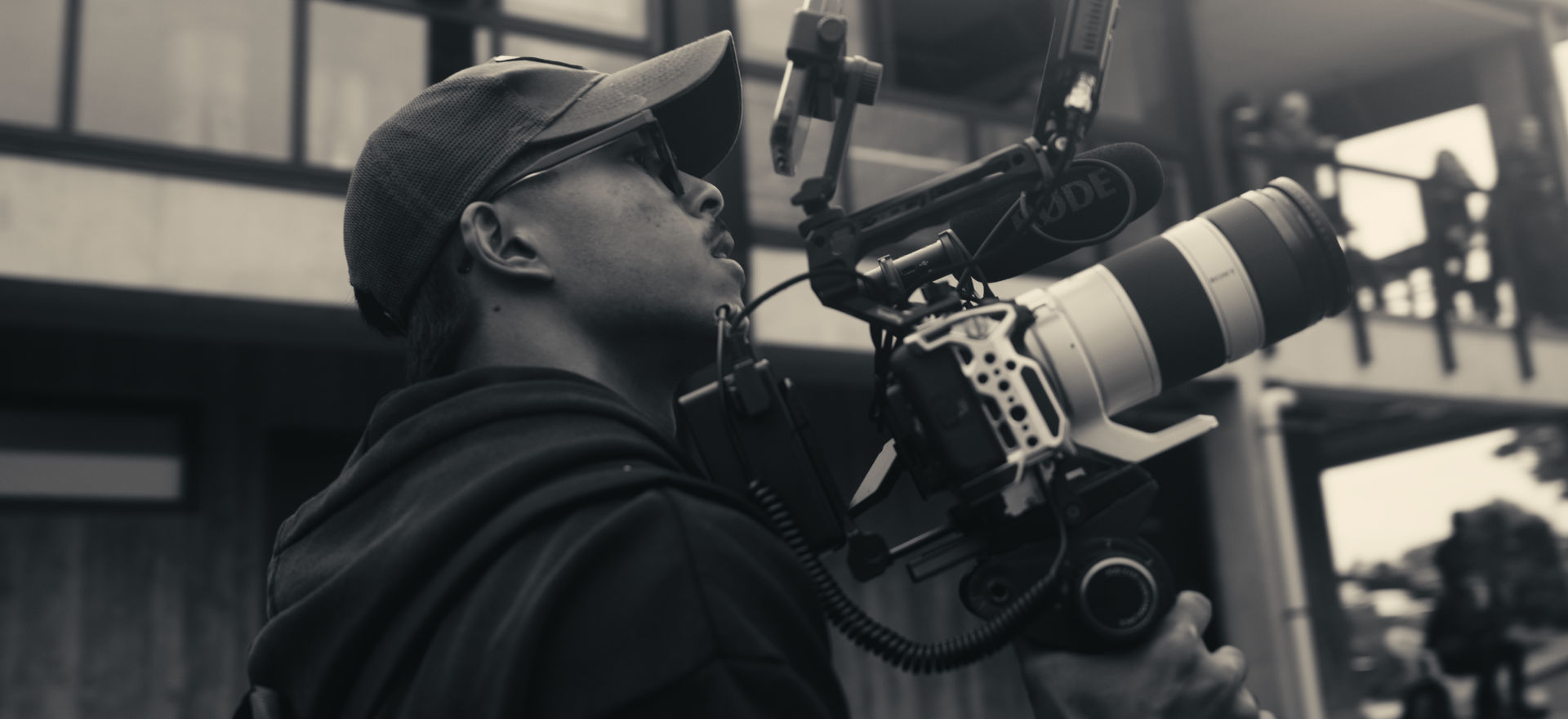 Hanz Lopez carrying camera gear on set